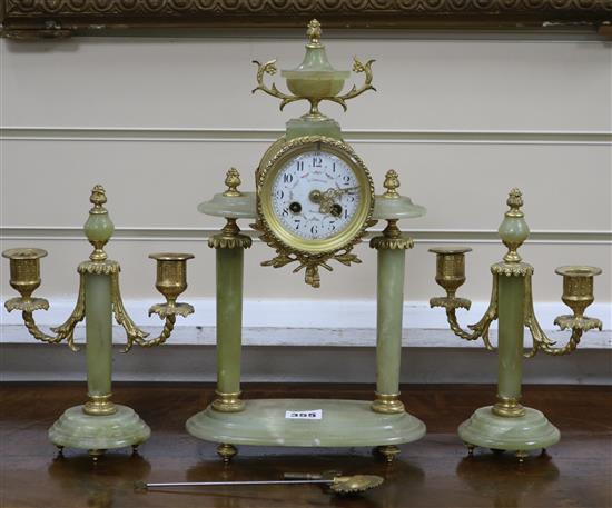 An early 20th century ormolu mounted green onyx clock garniture, the clock signed Galier Rouen clock 37cm candelabra 23cm